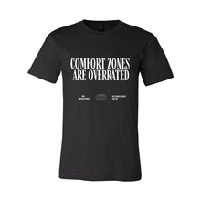 Load image into Gallery viewer, Black t-shirt with white text 'COMFORT ZONES ARE OVERRATED' on a white background

